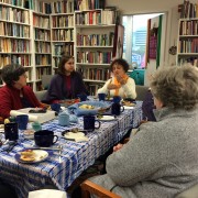 The WATER community hosts Clarita Luz Ajo Lázaro (end of table) for coffee, tea, and lively conversation